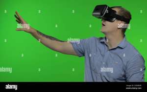 Man using VR technology app headset helmet to play simulation game