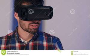 Smiling Man in Vr Glasses Looking into the Camera after Virtual
